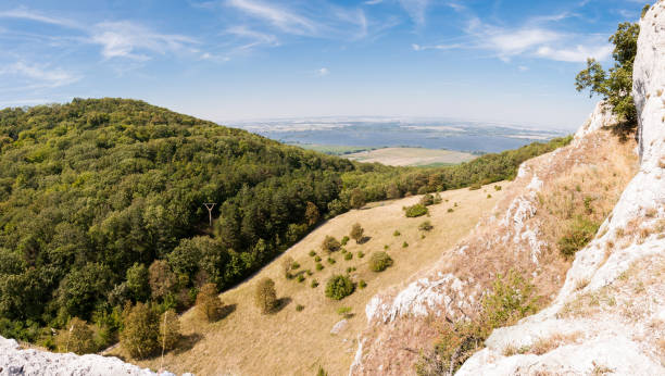 istock Rock landscape with grass and blue sky 1130271576