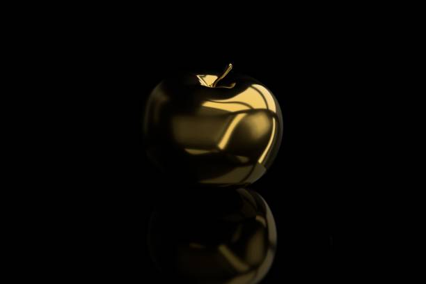istock Golden apple isolated on black background 1130274745