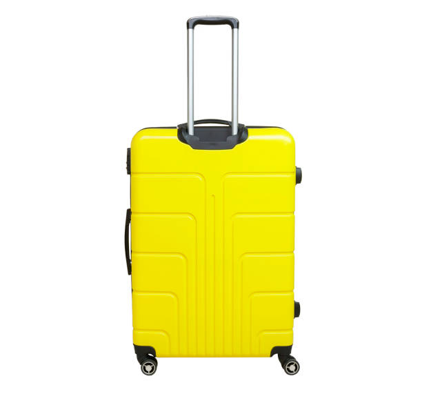 istock Yellow suitcase isolated on white background. Polycarbonate suitcase isolated on white. Yellow suitcase. 1130280008