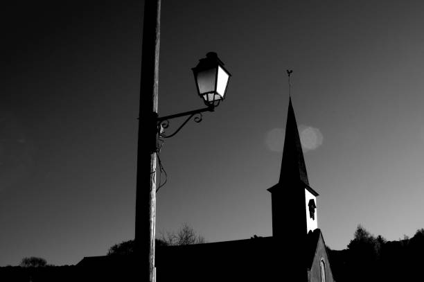 Church steeple silhouette, bright blue sky, copy space
