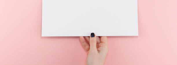 istock Woman hands with blank A4 paper sheet mockup 1130288141