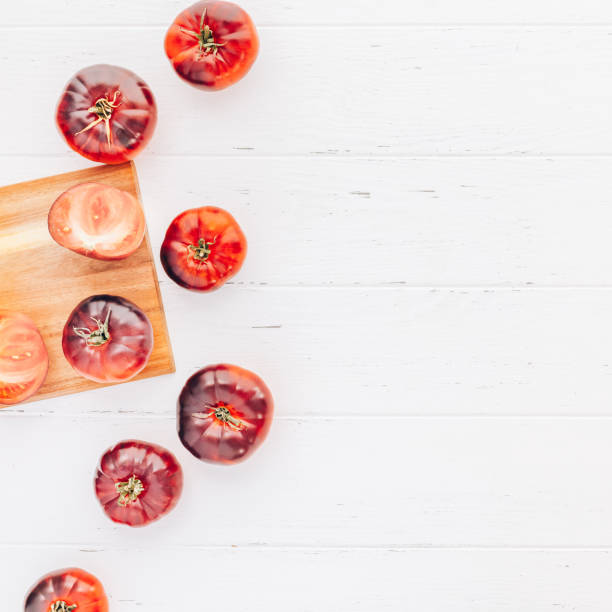 istock Tomatoes Mar Azul on white wooden table background 1130288472