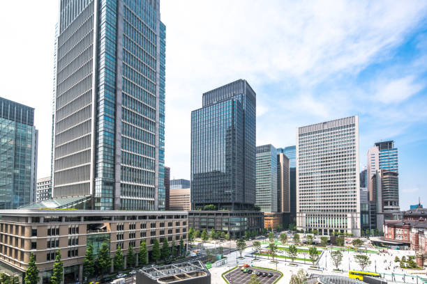 Marunouchi Business District in Tokyo, Japan. Tokyo - Japan, Japan, Office Building Exterior, City, Marunouchi low angle street japan stock pictures, royalty-free photos & images