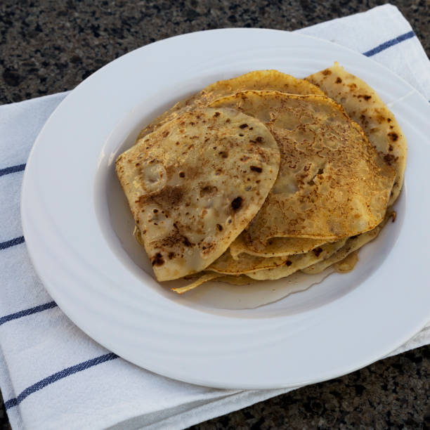 istock Homemade pancakes with honey for breakfast, low angle view. 1130289870