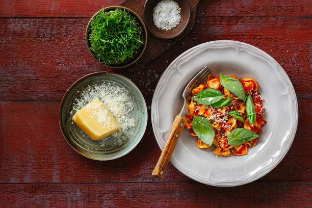Prosciutto and cheese tortelloni with tomato cream sauce