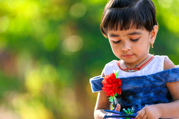 istock Indian Little Girl child writing on note book , studying 1130291112