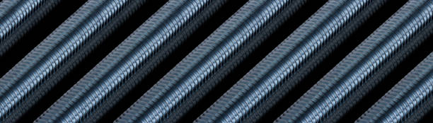 istock Corrugated striped metal tubes lying in a row on black background 1130291292