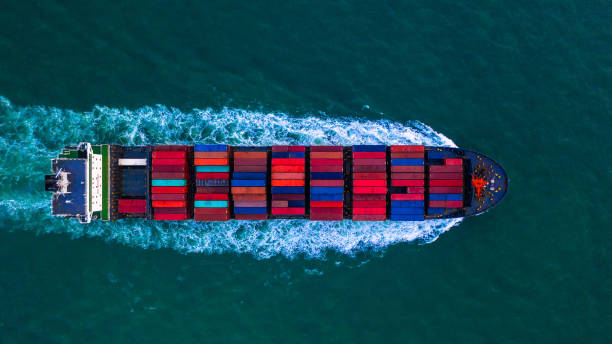 istock Container freight ship carrying container box for import and export business logistic and transportation by container ship in open sea, Aerial view. 1130292146