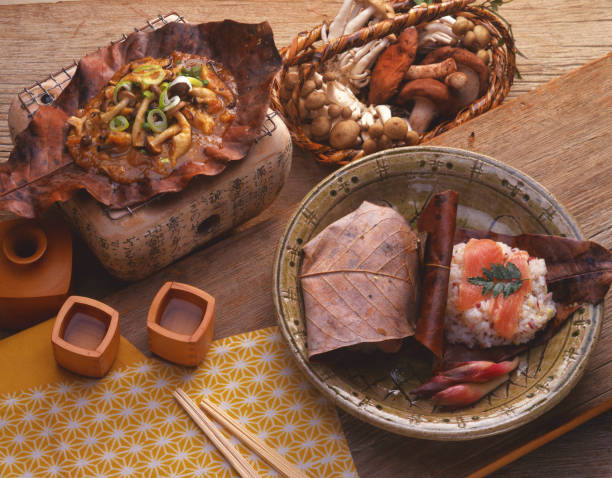 Hoobayaki and Hooba-sushi local cuisine / Hida Takayama Cook called Hooba-miso is a local cuisine that is still being eaten in the Hida Takayama region of Japan. It is a dish which bakes a miso on ingredients by wetting the dried leaves of the plant called Hooba, putting it on fire. gifu prefecture stock pictures, royalty-free photos & images