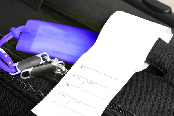 istock Traveling suitcase with checkin label (manual focus) 1130296758