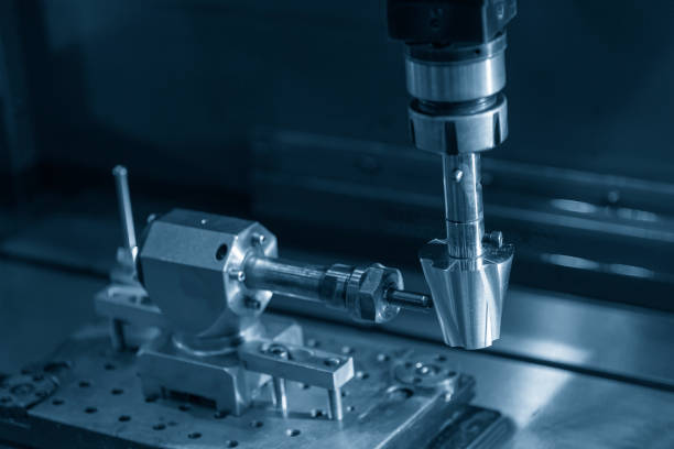 istock The EDM machine making the spiral groove on the cone shape. 1130300557