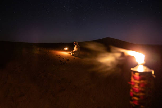 istock Arabs camping at night in the desert 1130301788