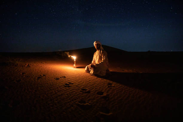 Arabs camping at night in the desert