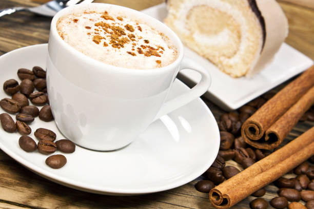 istock Coffee beans and coffee with cinnamon and cake 1130304794