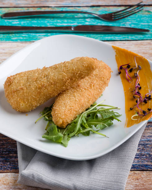 istock tasty fresh fried breaded cheese on white palte 1130306232
