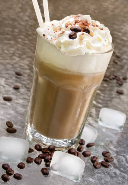 Iced coffee with cream and coffee beans
