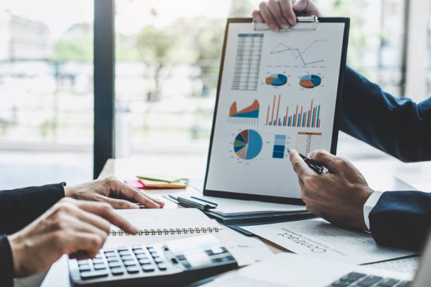 istock Finance manager meeting discussing company growth project success financial statistics, professional investor working start up project for strategy plan with document, laptop and digital tablet 1130310328