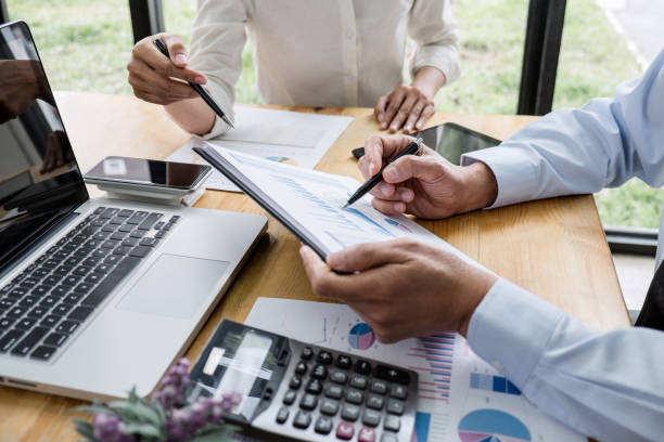 istock Two business team manager having a discussing with new project success financial statistics, Partner meeting professional investor working start up project for both company with document 1130310456