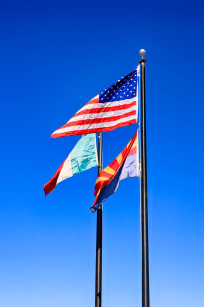 istock Mexican, American and Arizona state Flags at the Border between the two countries 1130310874