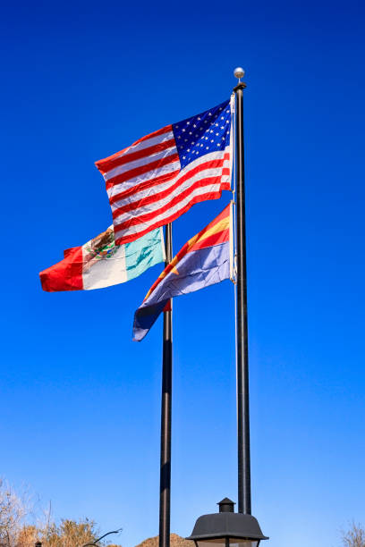 istock Mexican, American and Arizona state Flags at the Border between the two countries 1130310883