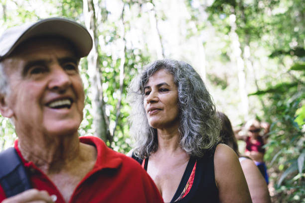 istock Senior friends walking in the forest 1130312416
