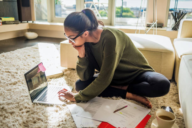 istock young woman working on a project at home 1130312626