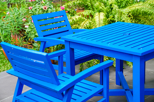 wooden blue chair and table in the garden