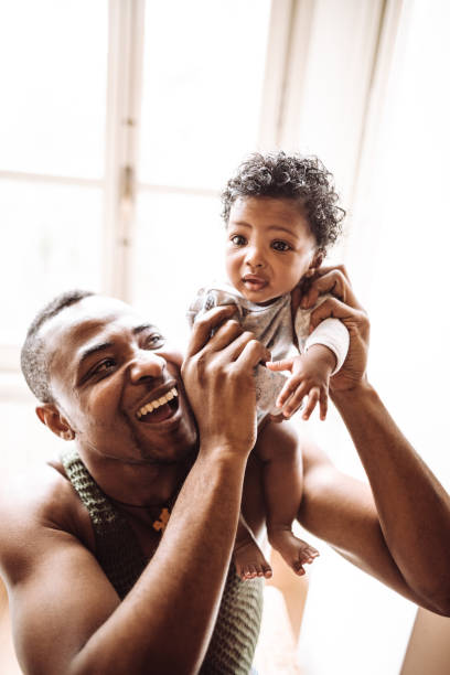 istock african family have fun in the sofa 1130313652