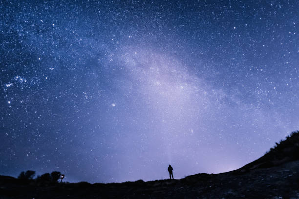 Senior Caucasian man starry sky background stock photo
