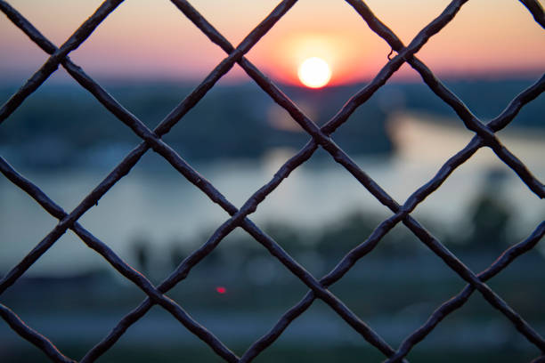 The sunset through a lattice fence