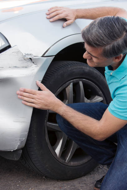 istock Unhappy Driver Inspecting Damage After Car Accident 1130315969