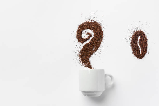 istock White ceramic cup of coffee with curly steam and bean made from grounds. Creative food artwork. Breakfast energy concept. Design element template for social media cafes restaurants bars 1130318720