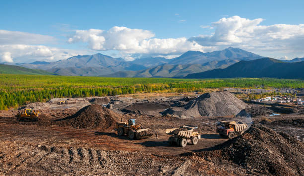 istock Excavation, loading of stone soil into mining dump trucks in mountainous areas (open-pit gold mining in Eastern Siberia) 1130319468