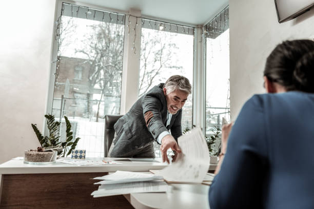 istock Tall grey-haired handsome man in eyeglasses looking annoyed 1130319849