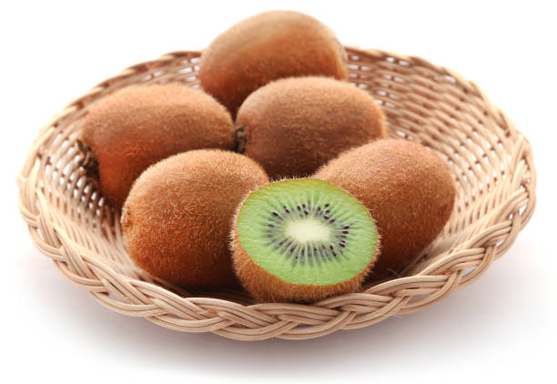 Kiwi fruits in a basket over white background