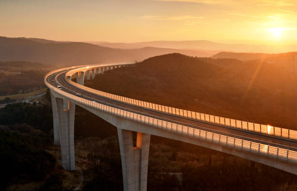 istock Cars driving on a highway viaduct 1130323070