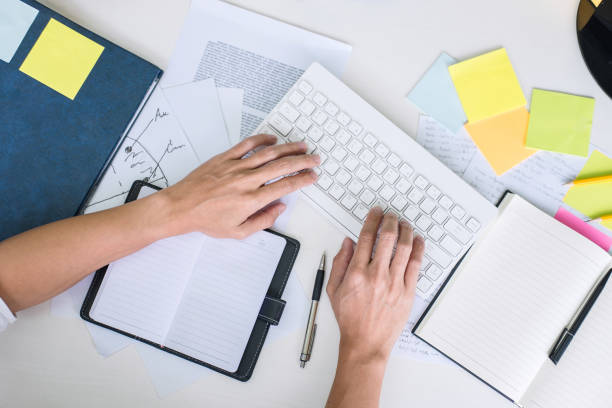 istock Businessman working writing making note business plan and graphic designer with computer in office 1130323343