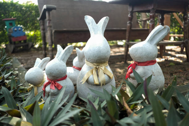 istock Rabbit figurine in the garden leaves 1130323417