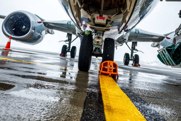 Passenger aircraft on maintenance and flight preparation. View under airplane fuselage in airport