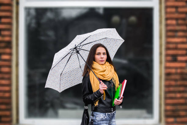 istock Girl with umbrella 1130324758