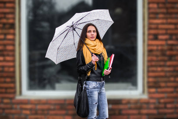istock Girl with umbrella 1130324766