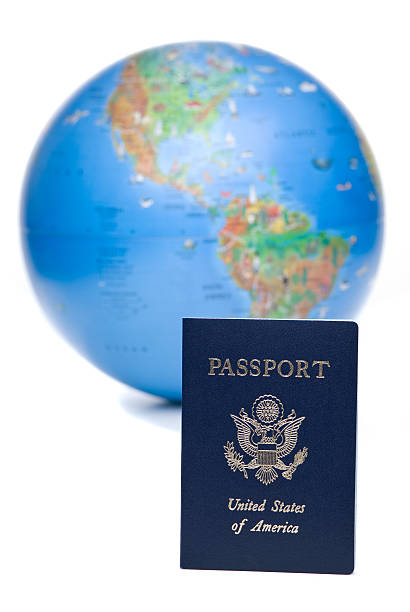 istock American passport in front of world globe, over white background 113032504