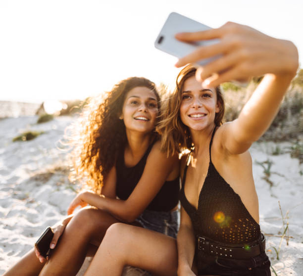 istock friends take a selfie at the beach 1130327316