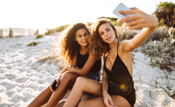 istock friends take a selfie at the beach 1130327505