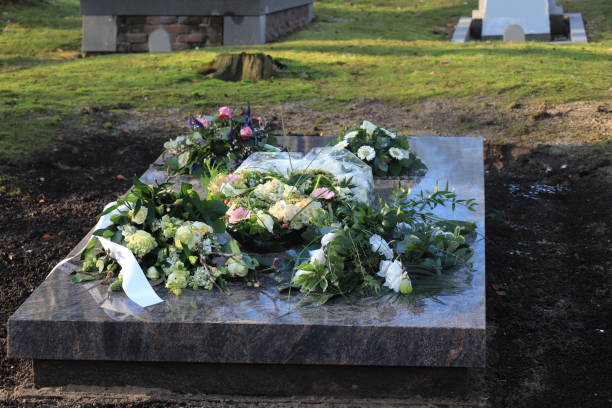 istock Sympathy flowers on a grave 1130327626