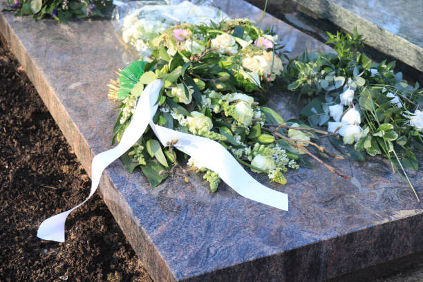 istock Sympathy flowers on a grave 1130327674