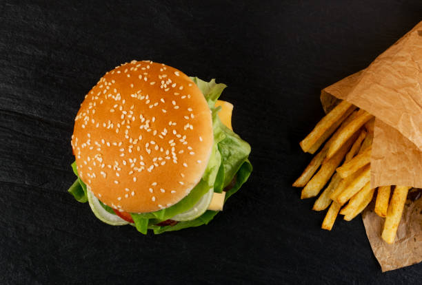 chicken burger with french fries garnish top view - food elegance cutlet restaurant imagens e fotografias de stock