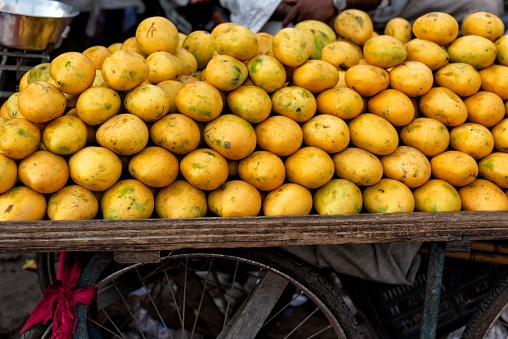 A pile of mango fruits stacked on a cart in a market in Rajasthan in india,
