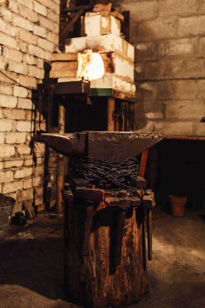 istock blacksmith workplace: anvil, hammers, furnace 1130330626