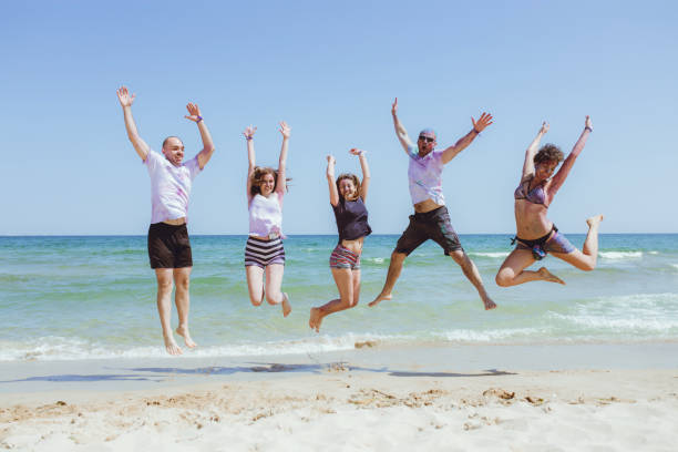 istock Jump of joy at the beach 1130336048